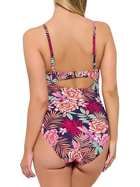 The Christina Bungalow Rose D Cup Crossover One Piece is your instant getaway! With a tropical print, a flattering low plunging neckline, adjustable straps, and a built-in bust enhancer, this 'Barbie-esque' one piece is your ticket to a beautiful beach day. Get ready to shape, sculpt, and stun in this summer style stunner!