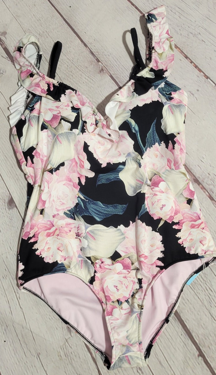 You'll be the belle of the beach with this sassy and sweet one-piece. The Baku Belle Cold Shoulder has a youthful fit that'll look oh-so-cute whether you're poolside or making waves at the beach. Oh, and let's not forget its flirty flower pattern and show-stopping ruffle details - it's sure to make you the prettiest petal in the bunch! Shine bright, baby!