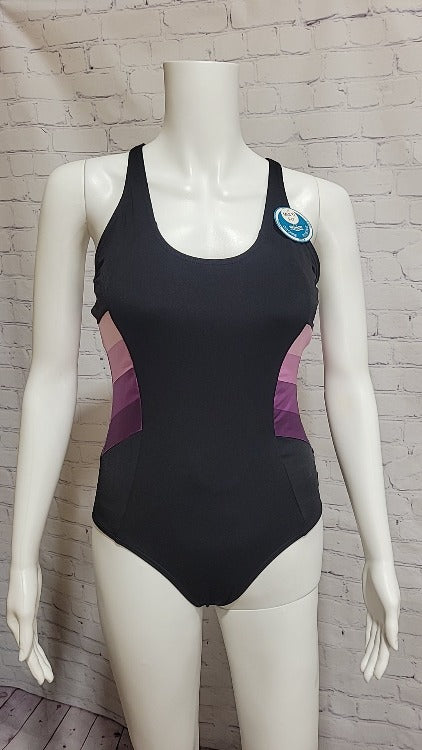 Put the max in your back with this one piece! The Max Back One Piece is sure to turn heads with its classic cut leg and scoop neck. Not to mention its ombre side panels offer a unique twist you won't find anywhere else. With a multi fit A-D cup, get ready to make a splash and show off your best moves. Dive in!