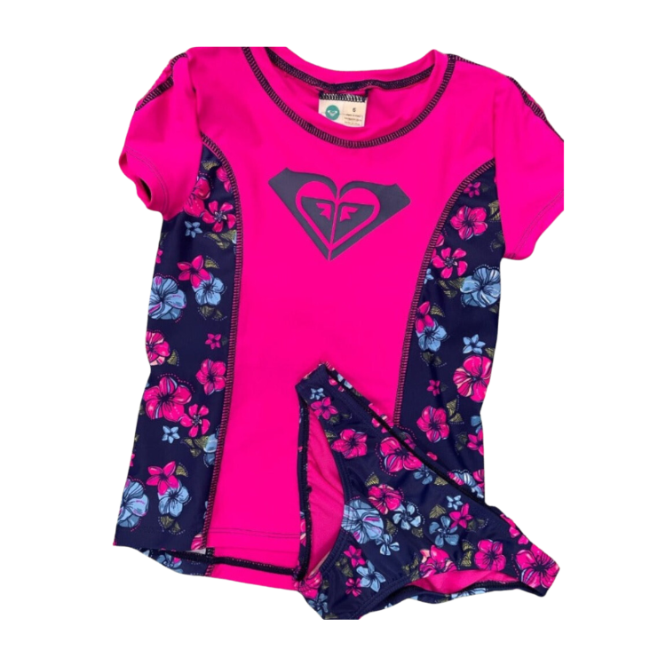 Dive into fun in the sun with this Roxy Tropical Traditions Rashguard Set! With a little girl's favorite colors of bright neon pink and blue, plus tropical flower detail, she'll make a splash no matter where she goes! This two-piece set's elastic on the top of the sleeves provide extra security and extra fun! Make a splash (of style!) with this adorable set!    CRS60046