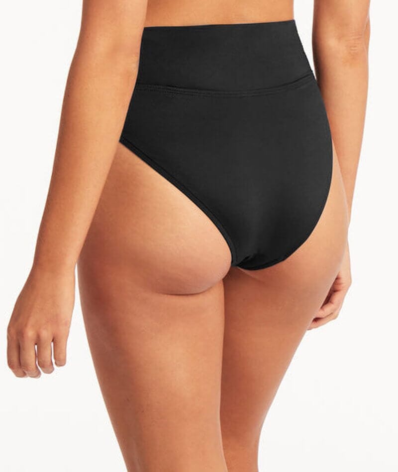 Look good and do good with this Wrap High Waisted Bottom from Sea Level Swim! This stylish swim bottom is made from recycled nylon and elastane to minimize its environmental impact while offering premium comfort and support. Plus, the soft folded waistband can be worn high waisted or rolled down, perfect for whatever mood you're in. Make a splash with this eco-friendly look!     SL4495ECO