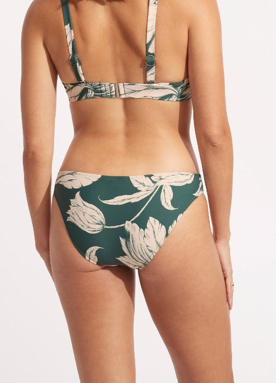 Seafolly Fleur de Bloom Longline Triangle Bikini  Style# 31401-983 40054-983  Look ever fabulous in evergreen! This long line triangle top Seafolly two piece checks all the boxes while offering a sporty feel. The beautiful structured top and hipster bottoms offer a classic bikini shape with a moden colour palate and design.  