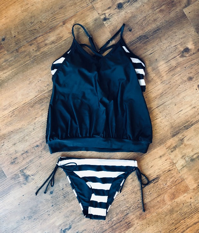 The Striped Blouse Tankini Set is your tummy's new BFF! Featuring a seriously stylish and sporty striped sports bra-style top and medium coverage tie side bottoms, you can flaunt your shape while keeping those tummy blues hidden. It's poolside perfection!