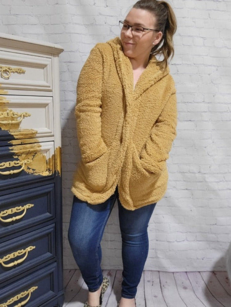 When the comfort of a robe and the effortless fit of a cardigan come together, you get the Robigan. Made from soft Sherpa, wrap yourself in warmth with our ultra-cozy robe.    Fits smaller we recommend sizing up if you have a curvy frame.