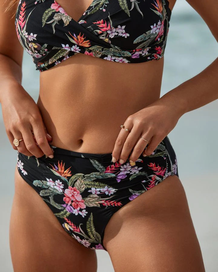 Dive in style with this beautiful Azura Brazil bikini set! Crafted from recycled and sustainable nylon, it'll have you looking and feeling your best with its ultra-flattering twist detail top, high-waist ruched bottoms and bold black floral print. Get ready to take the beach by storm!