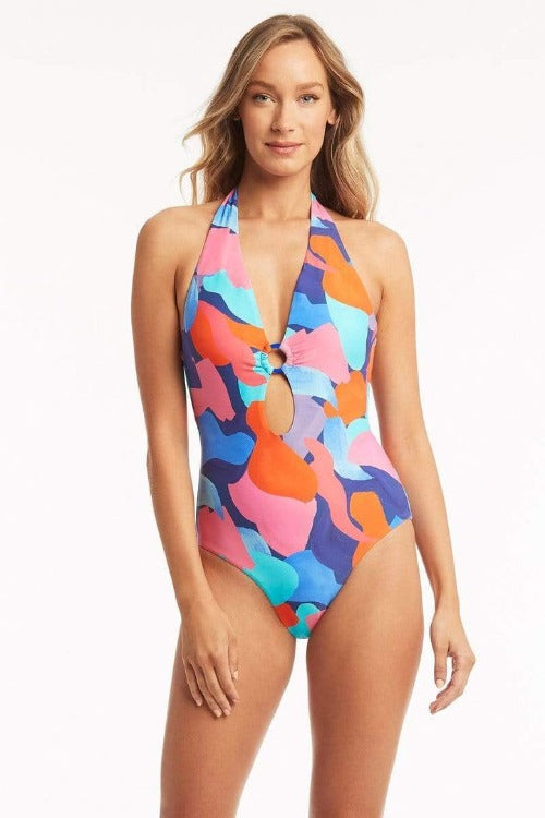 Sea Level Royal Print Paintball Keyhole Halter One Piece  Escape to a tropical paradise in this unexpected take on camouflage. Sea Level's hand painted design embraces bright beautiful hues of blues, pinks and corals. This adorable keyhole halter one piece has 90's vibes and feels retro with a modern twist. Show off your backside with a sexy low back and moderate seat coverage.  Style # SL1587PB